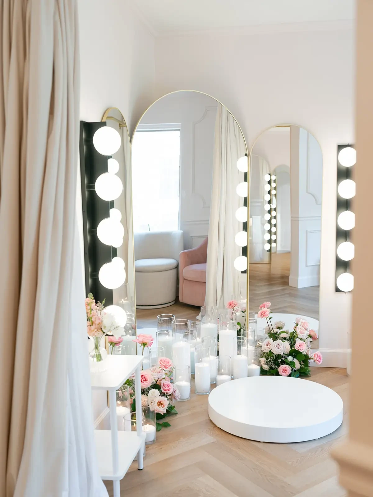 Image shows a fitting room where brides can look at themselves in the light up mirror