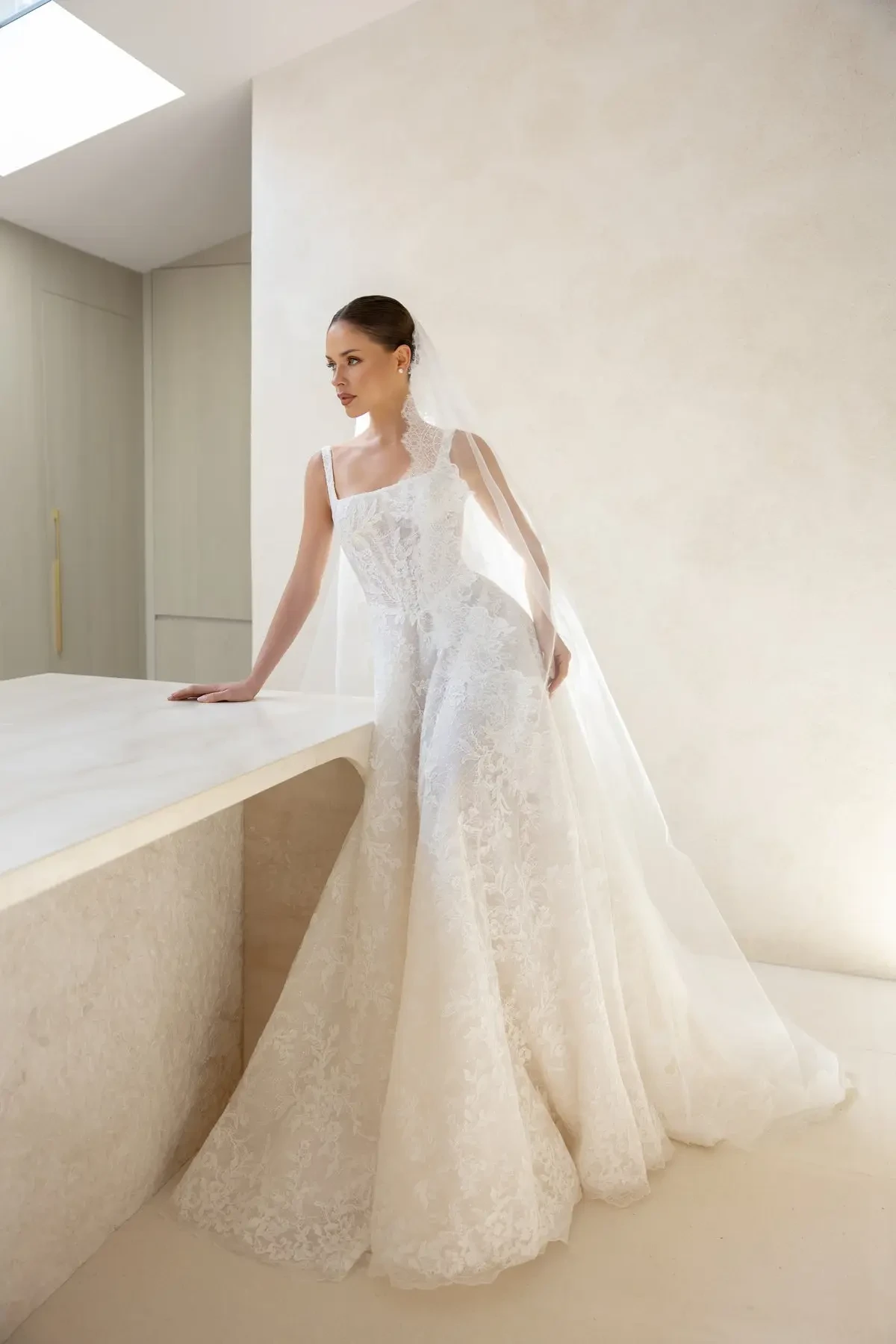 model is wearing a basque waist wedding gown