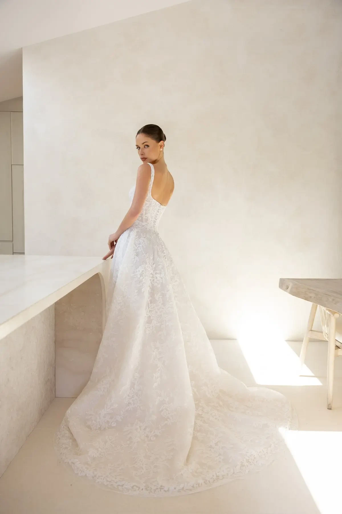 model is wearing a basque waist wedding gown