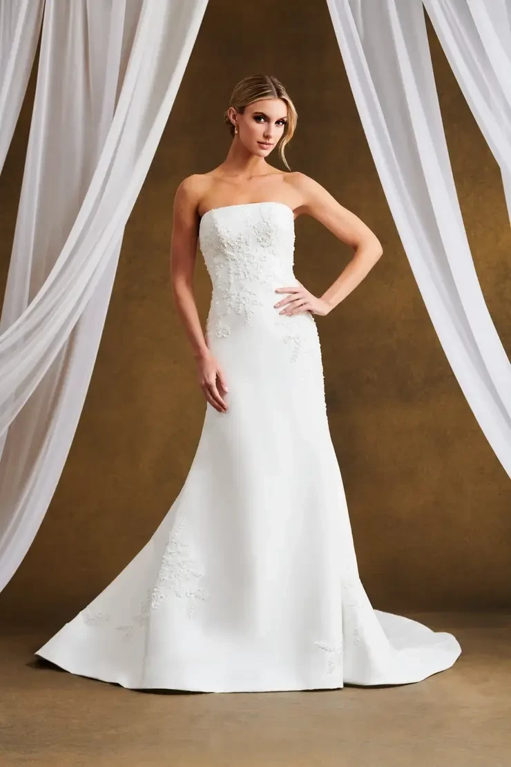 model is wearing a strapless fit and flare bridal gown