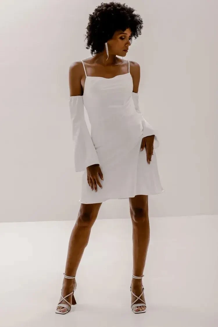 After the "I Do," It's Time to Embrace a Mini Dress Reception Outfit Image