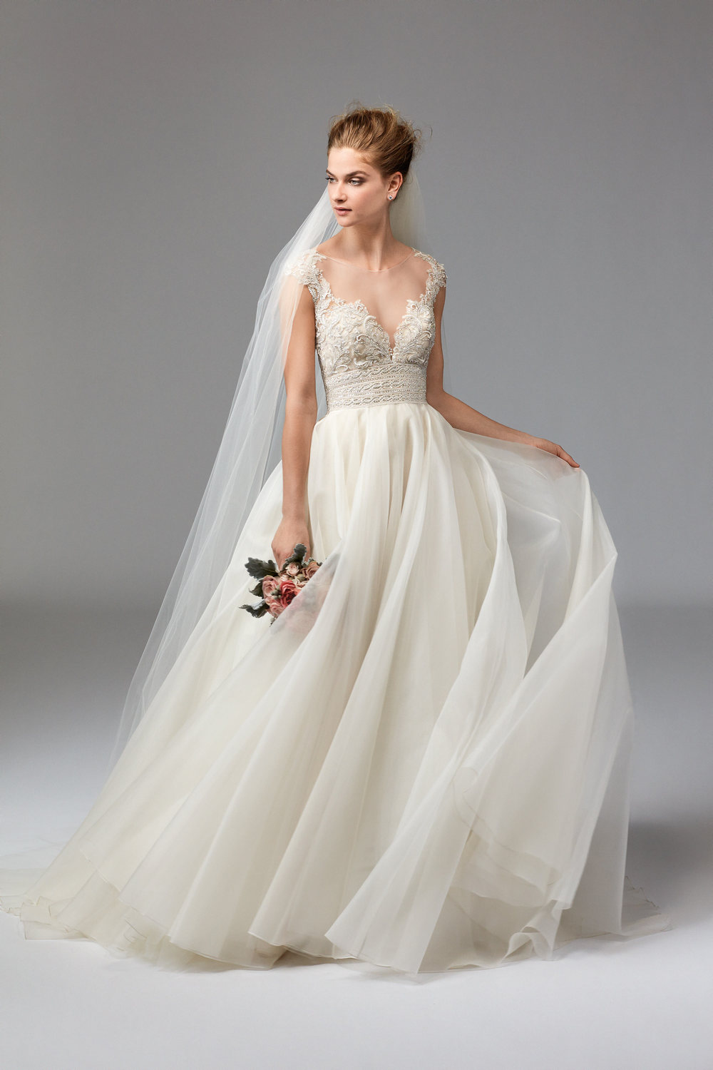 Azalea from Watters,&nbsp;accentuates her deep V-neckline with organza, crystals and pearls- making her one classy, hot mama!