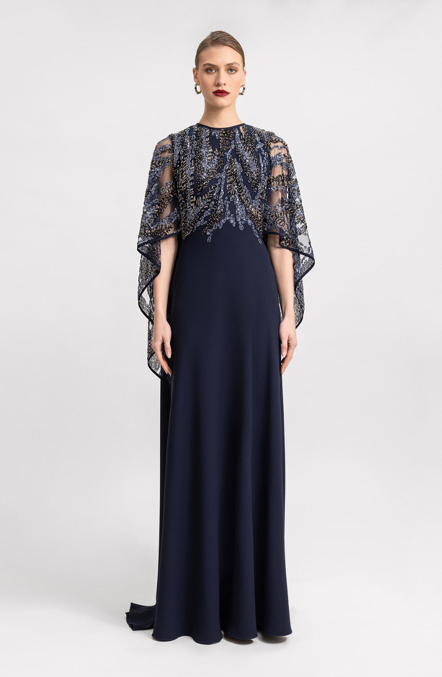 model is wearing a black evening gown by Gemy maalouf