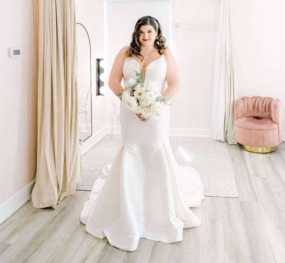 Photo of the model wearing a Plus Size Bridal Collection gown