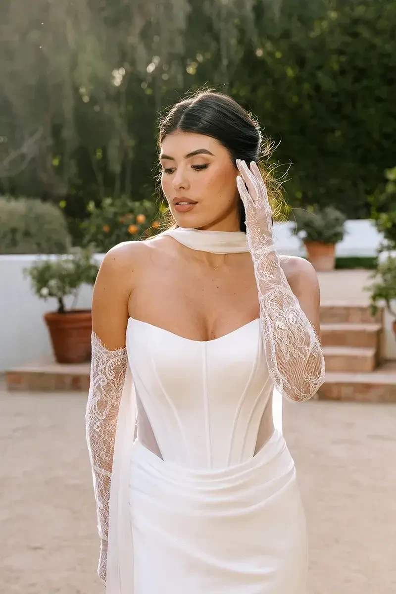 model is wearing a strapless fit and flare bridal gown