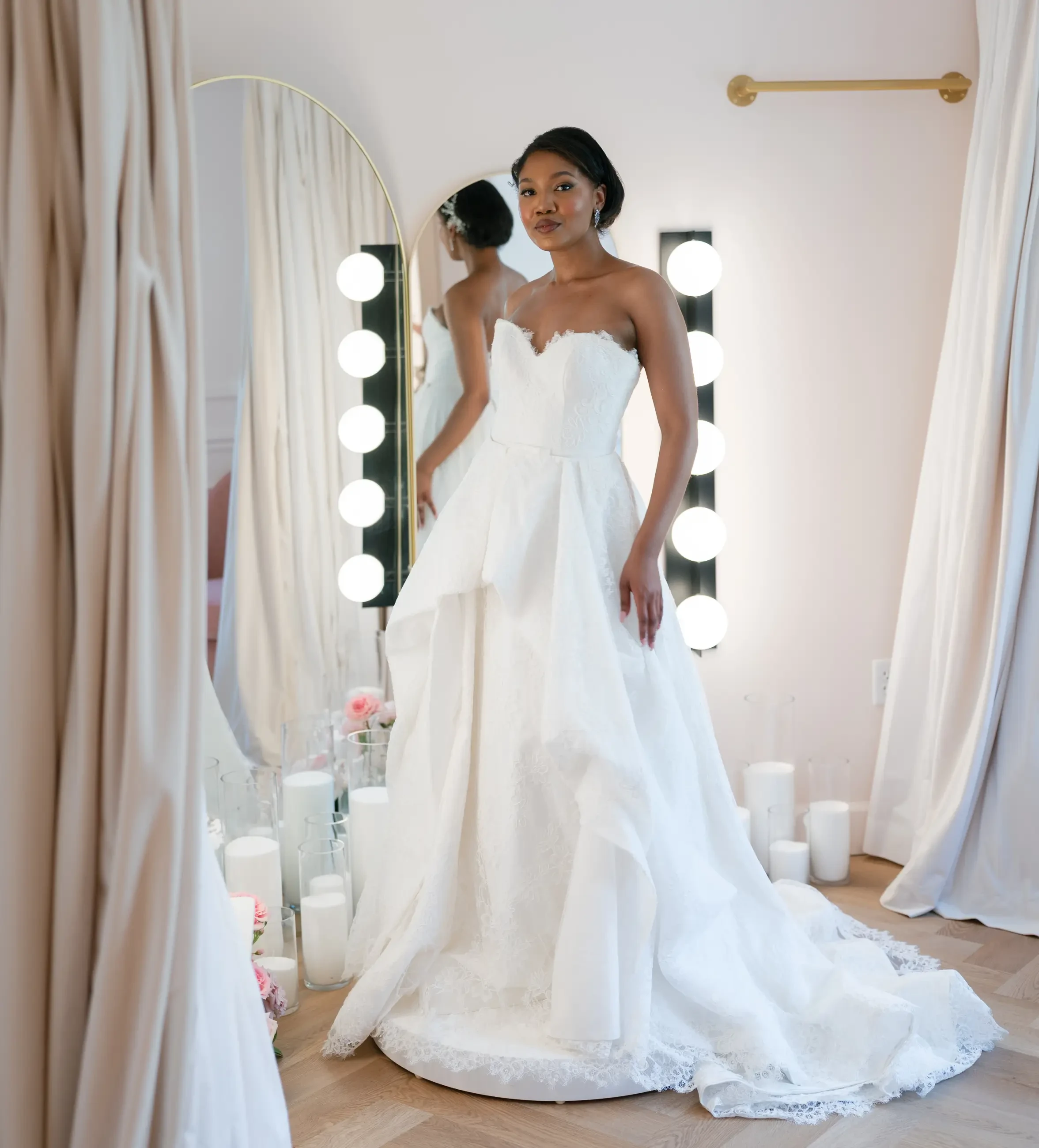 Model wearing a white gown. Mobile image